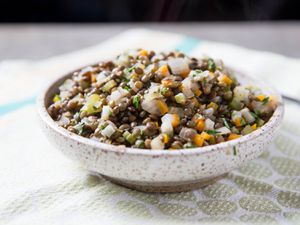 A bowl of simply-prepared French lentils with aromatics