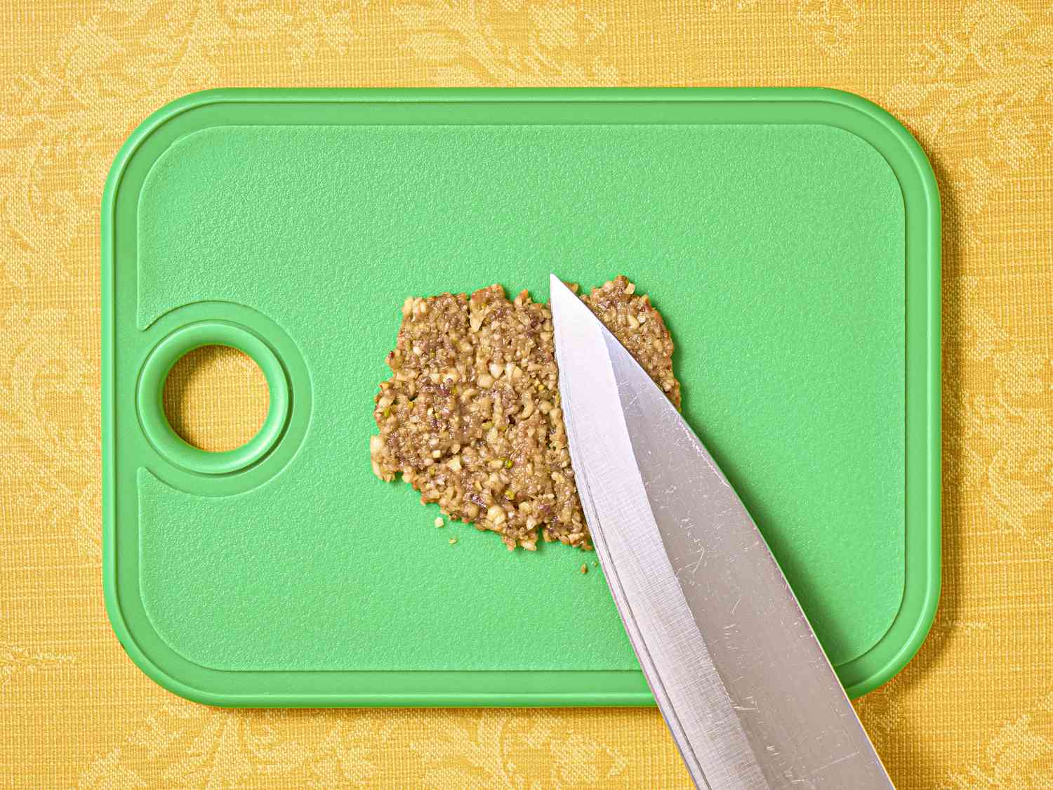Overhead view of mashing anchovies