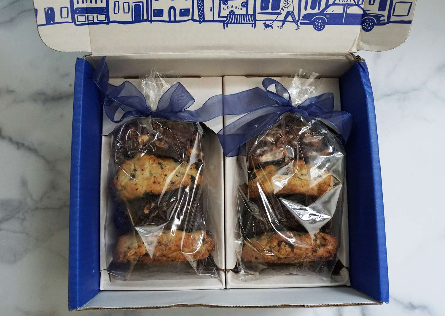 a box container eight cookies wrapped in plastic 