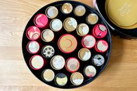 The Dandelion Chocolate Advent calendar, opened to show its mini chocolate boxes