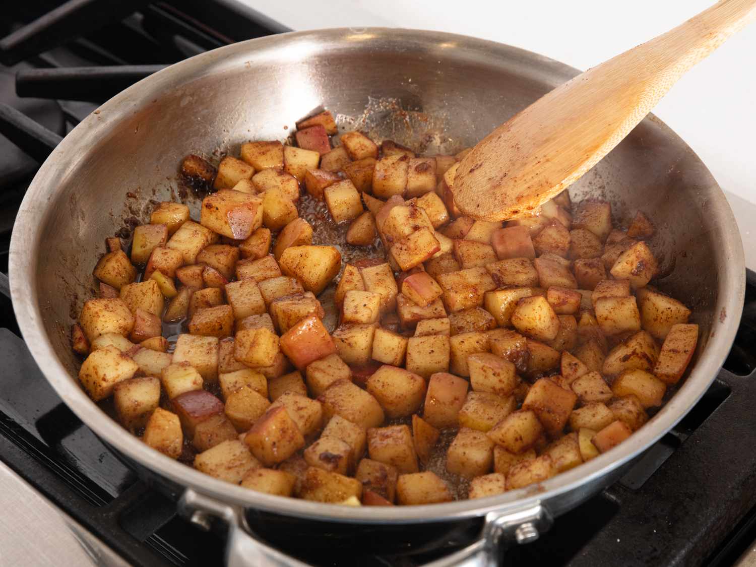 spiced apples cooking in a skillet 