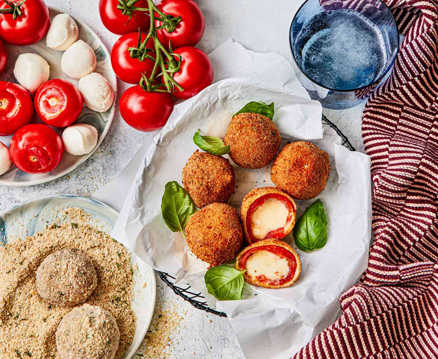 Fried caprese balls laid out on a plate.