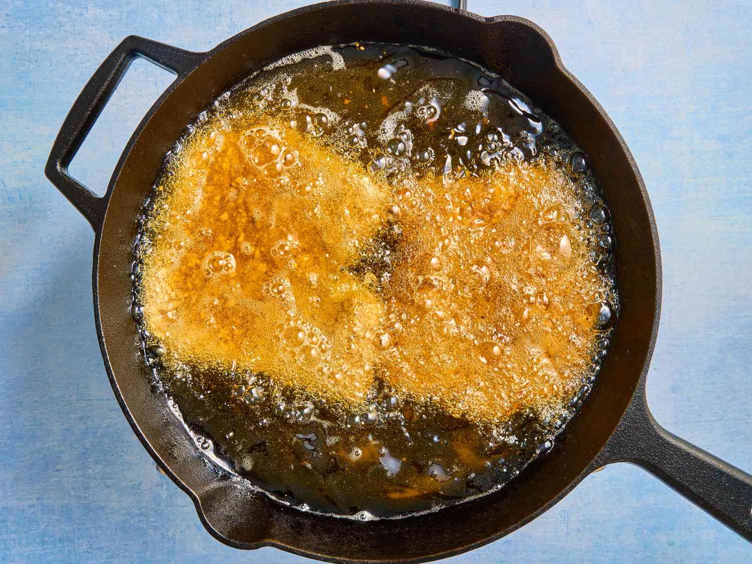 Overhead view of pork frying