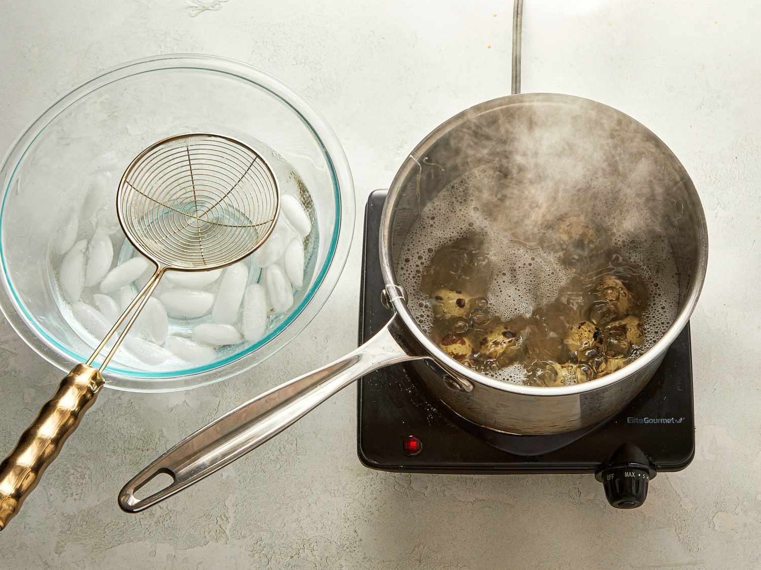 Cooking process with a pot of boiling liquid and a bowl of ice water nearby