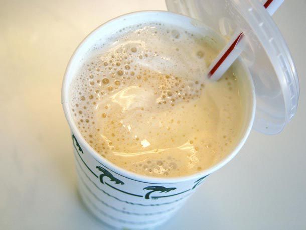 An overhead of a Root Beer Float in a In-N-Out cup