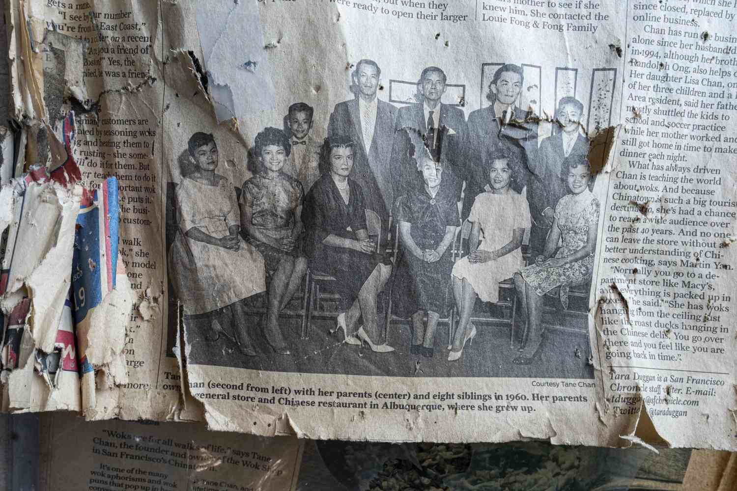 A torn up newspaper clipping showing Tane Chan's family
