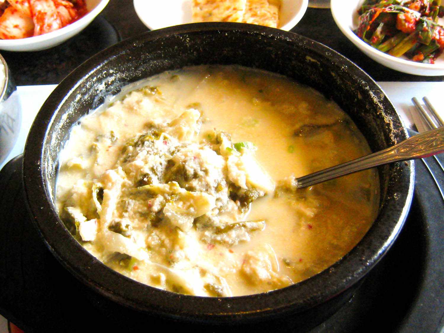 a clay pot of kongbiji jjigae