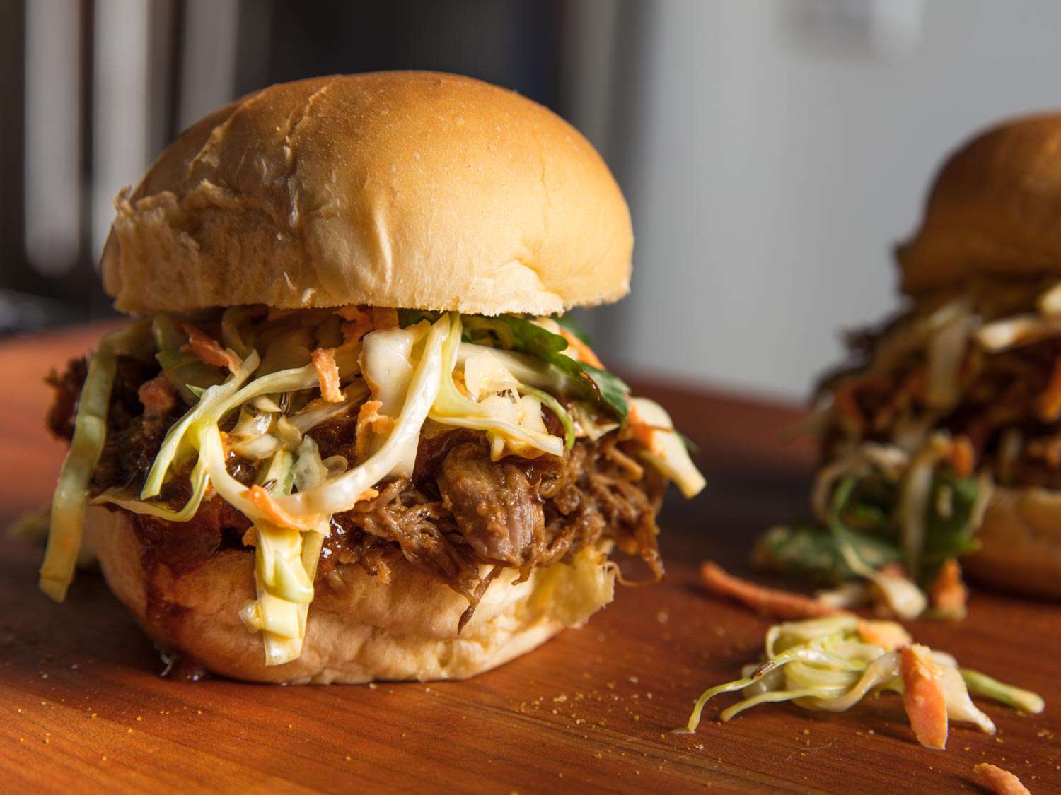 Closeup of an Indian-spiced pulled lamb sandwich