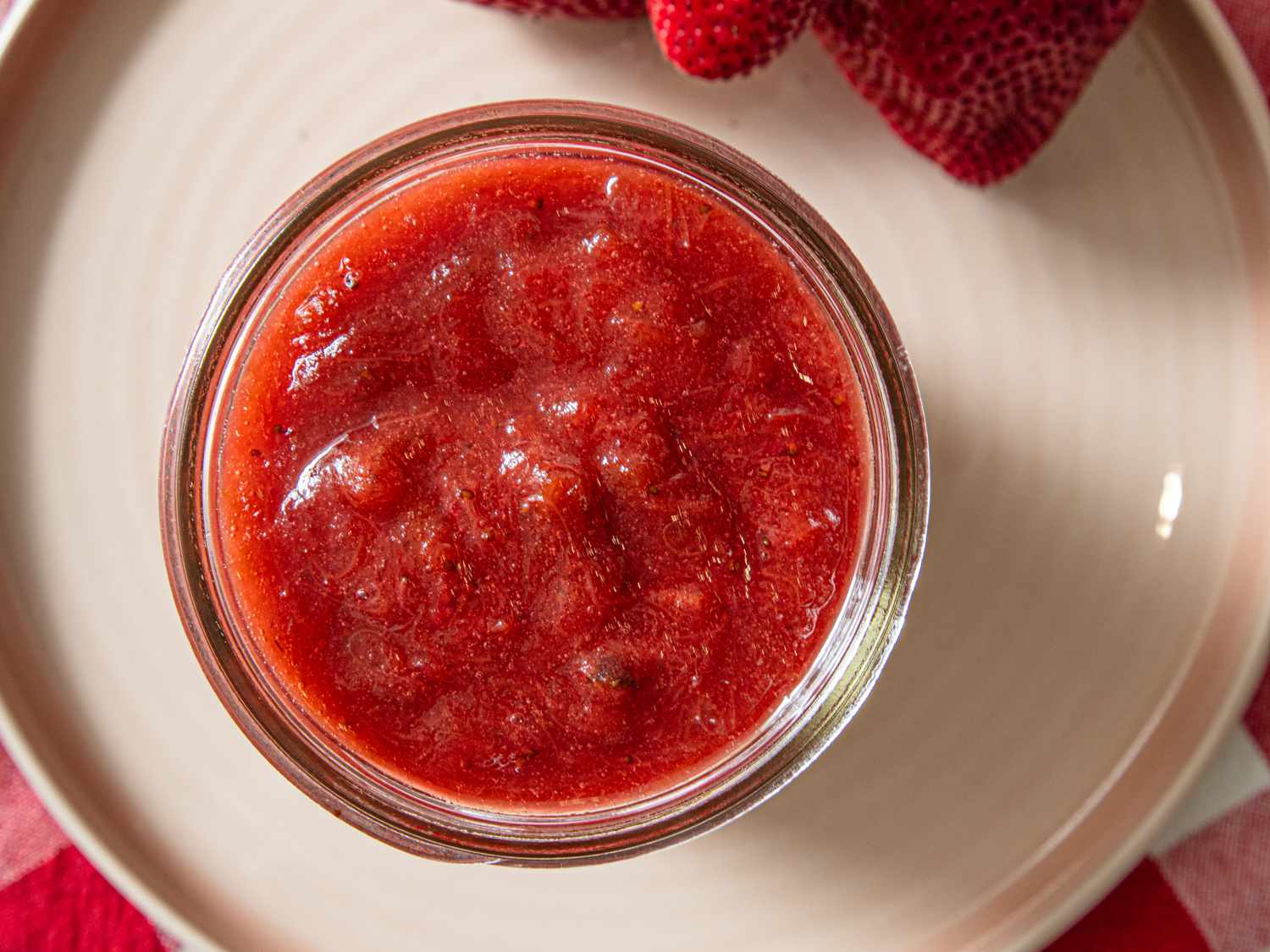 Jar of strawberry rhubarb jam viewed from above