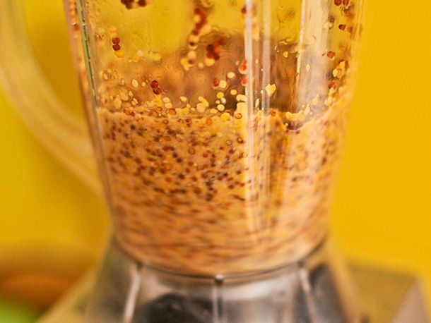 The mustard seed mixture is puréed in a blender.