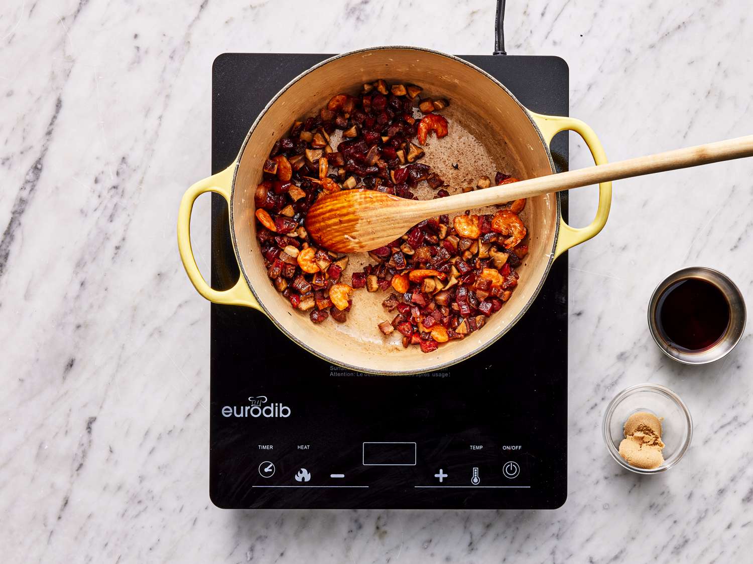 Sausage and bacon added to pot 