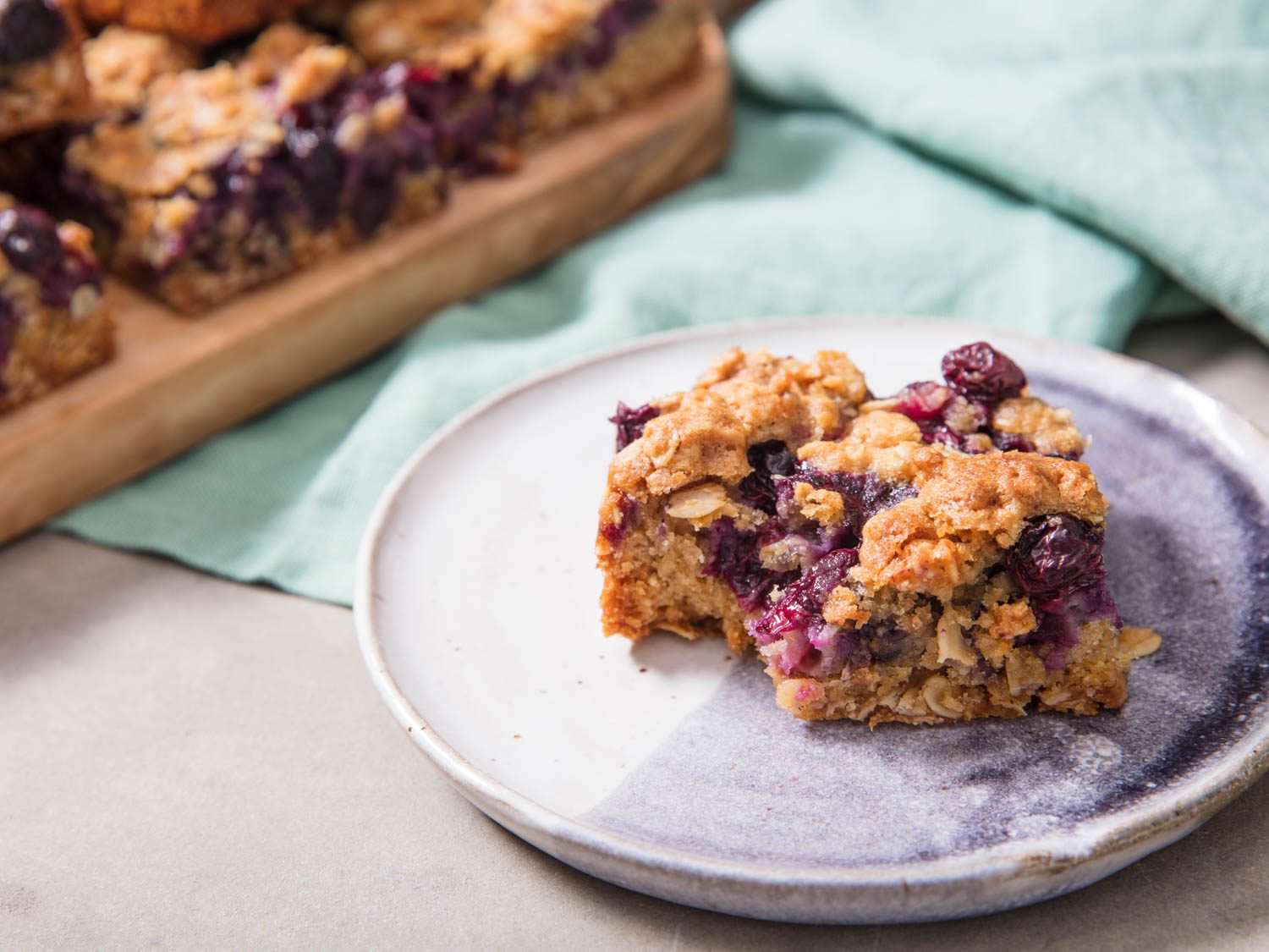 Close up view of a jammy fruit bar square.