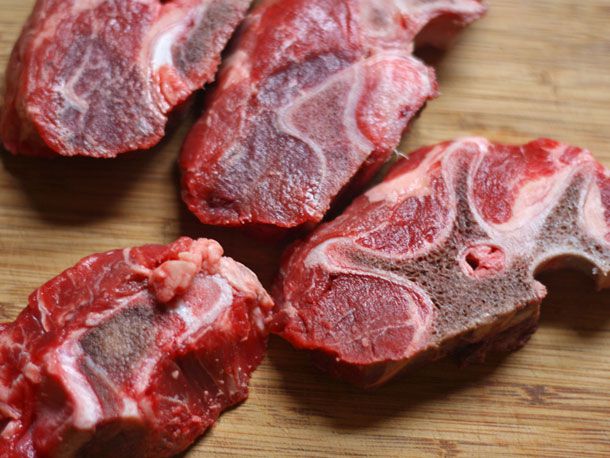 Close-up of meaty sliced beef neck bones.