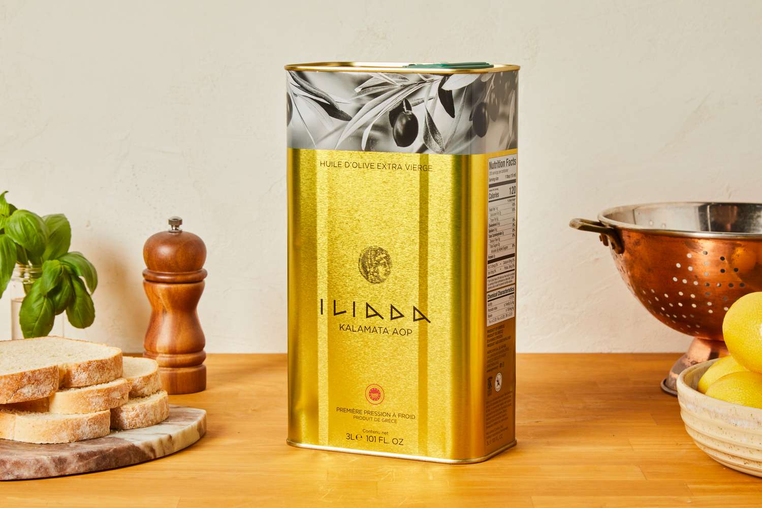 A tin of extra-virgin olive oil on a kitchen countertop.