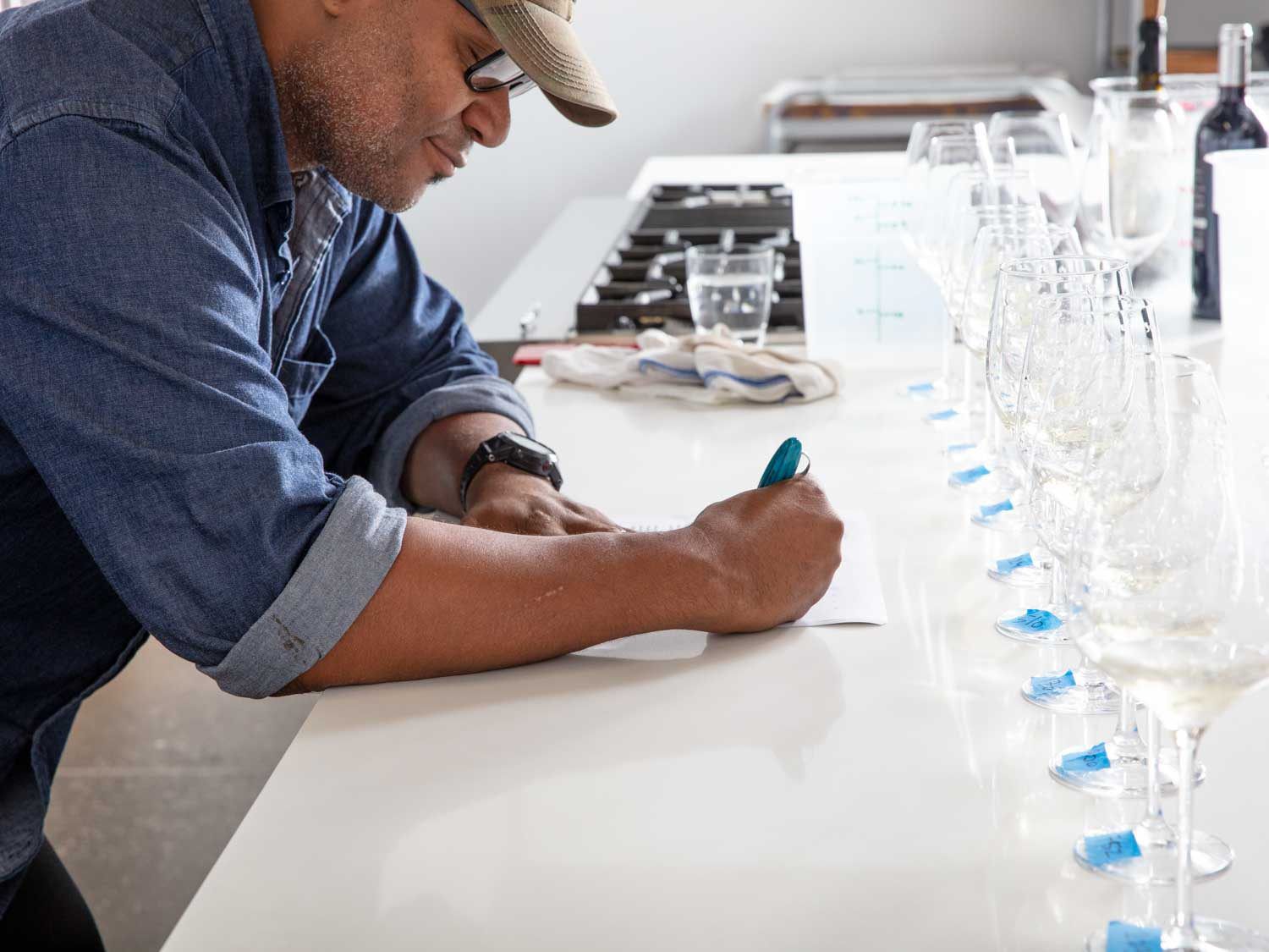 Andre Hueston Mack takes notes on wine.
