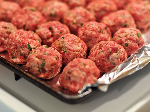 Formed meatballs on a foil-lined tray