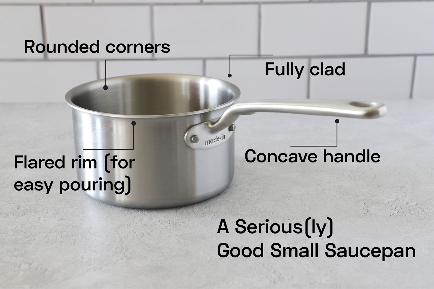 a small saucepan on a grey surface
