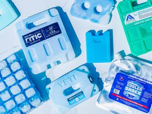 Various types of reusable ice packs arranged on a flat surface