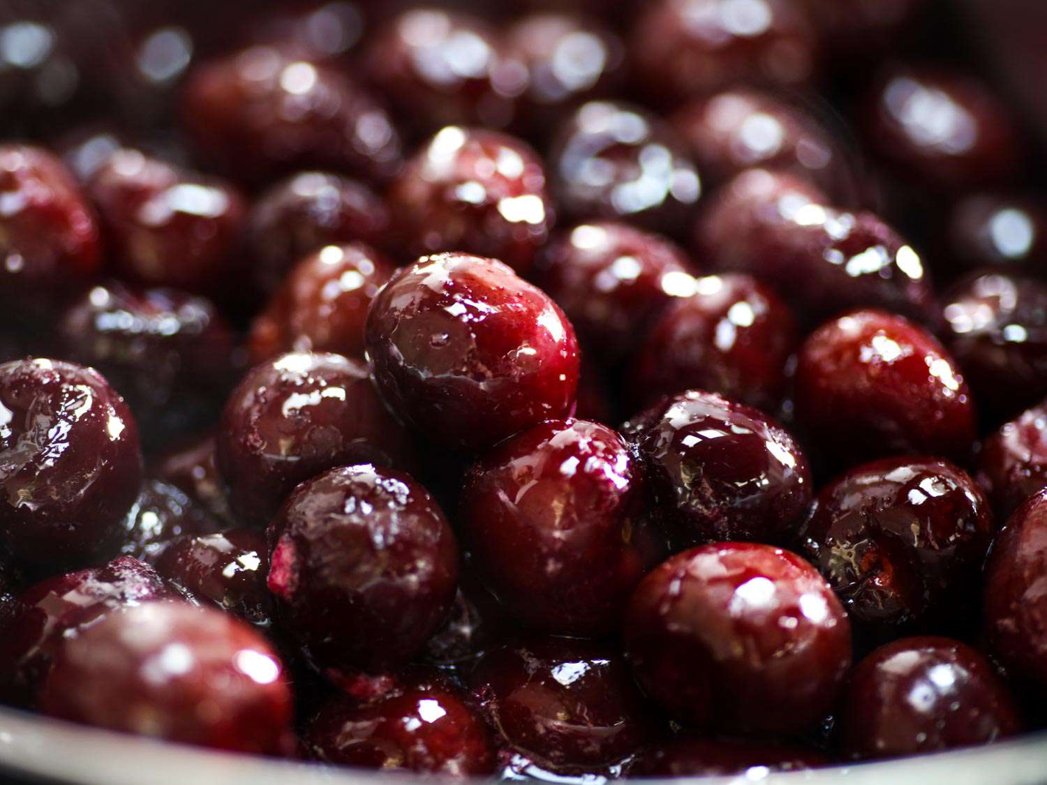 A close up of roasted cherries for cherry ice cream.
