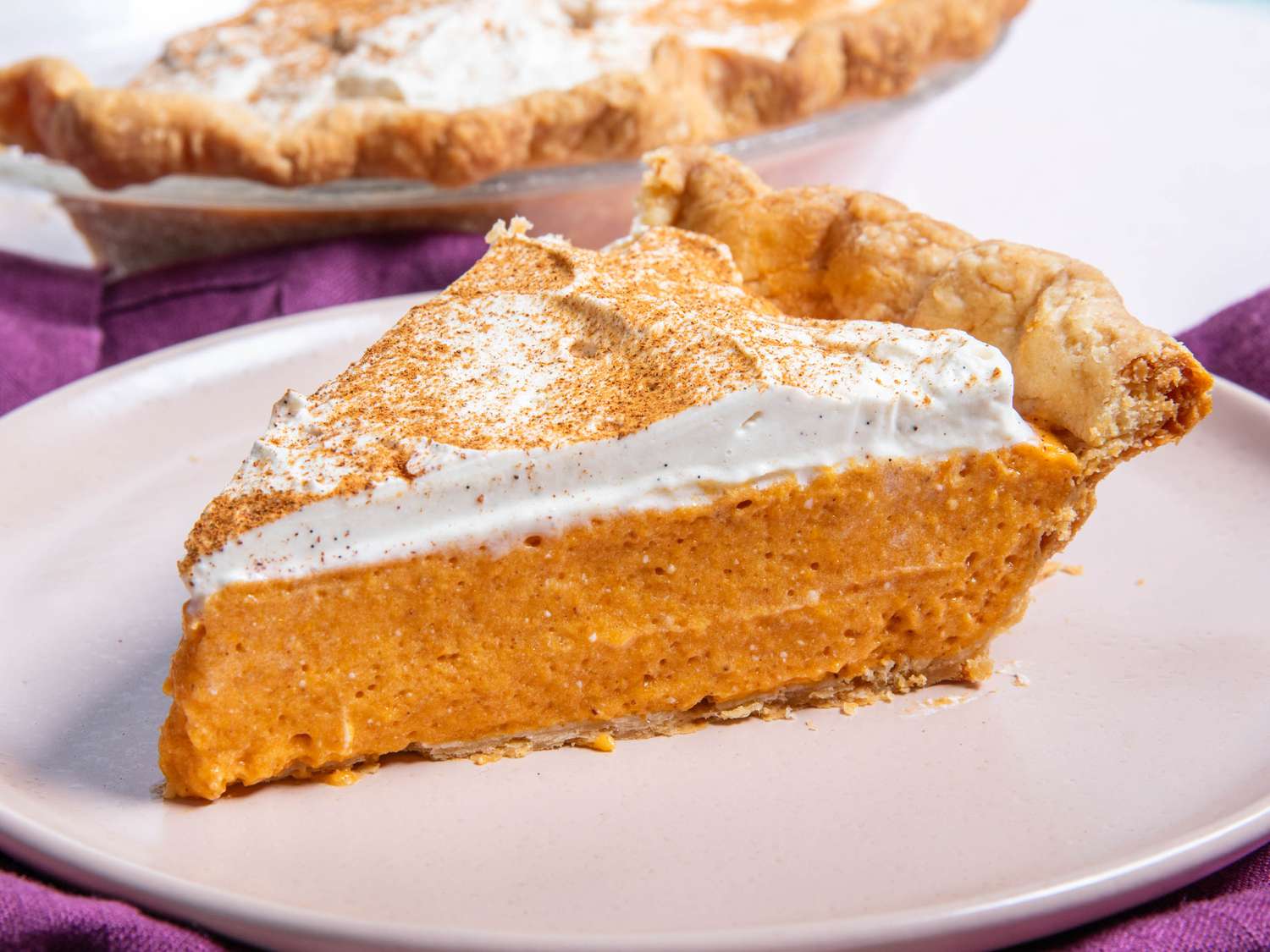 Side view of a slice of pumpkin chiffon pie