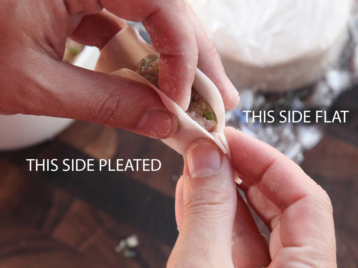 Dumplings being closed with one side being the pleated side and the other being the flat side.