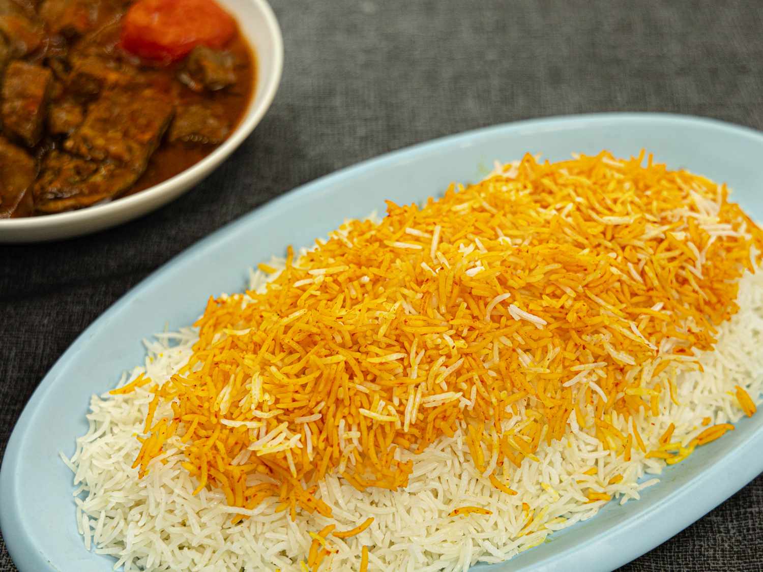 Overhead view of Persian rice on a blue platter