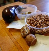 Eggplant and mushrooms resting on a cutting board.