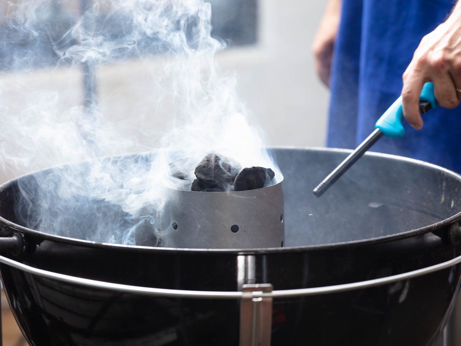 Lighting a charcoal chimney starter