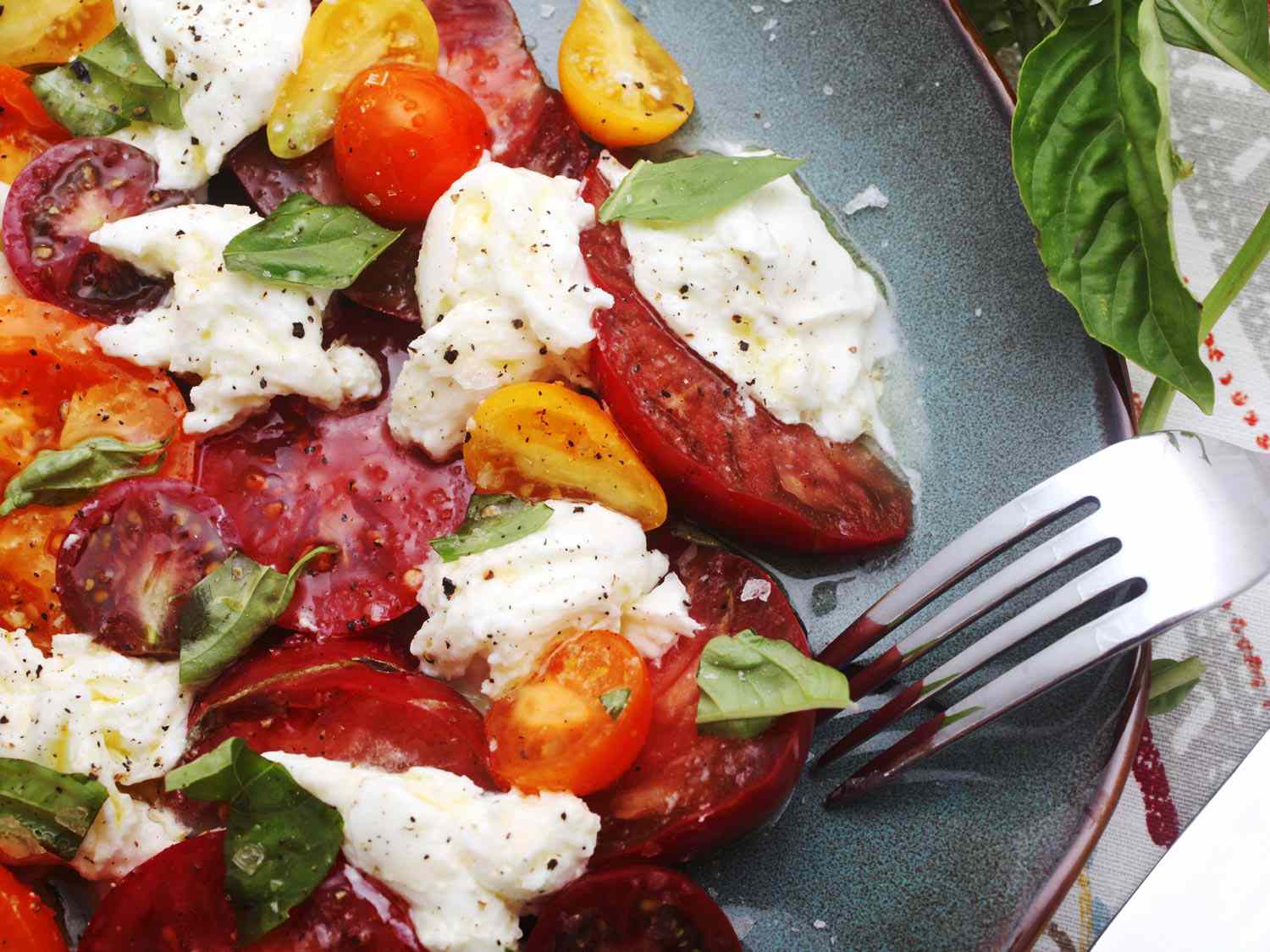 Close up of caprese salad on a serving plate. 