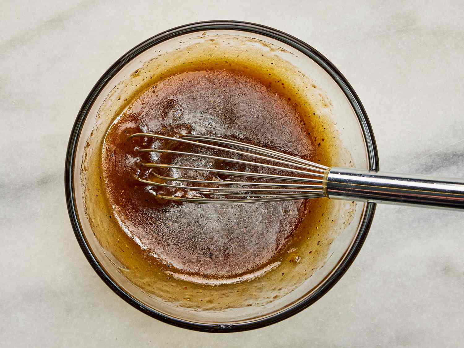 Overhead view of whisking dressing