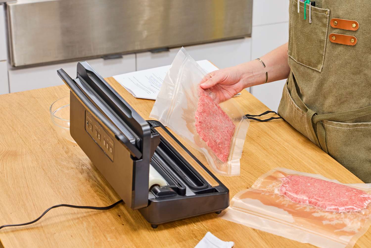 The Anova Precision Vacuum Sealer Pro vacuum seals meat