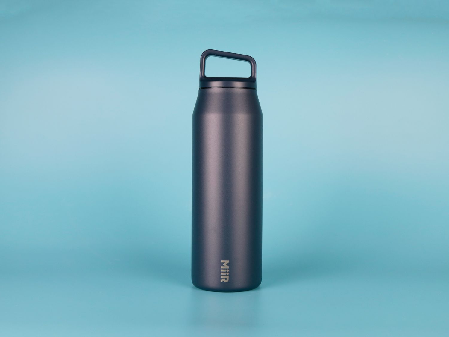 MiiR Wide Mouth Water Bottle against blue backdrop
