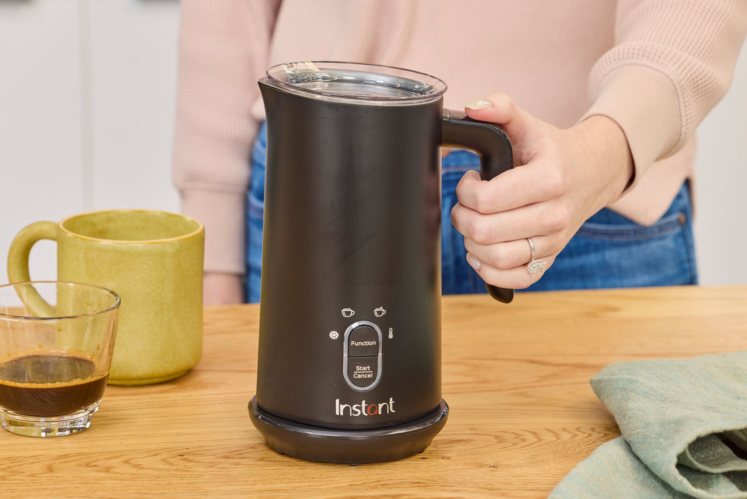 The Instant milk frother on a kitchen countertop.