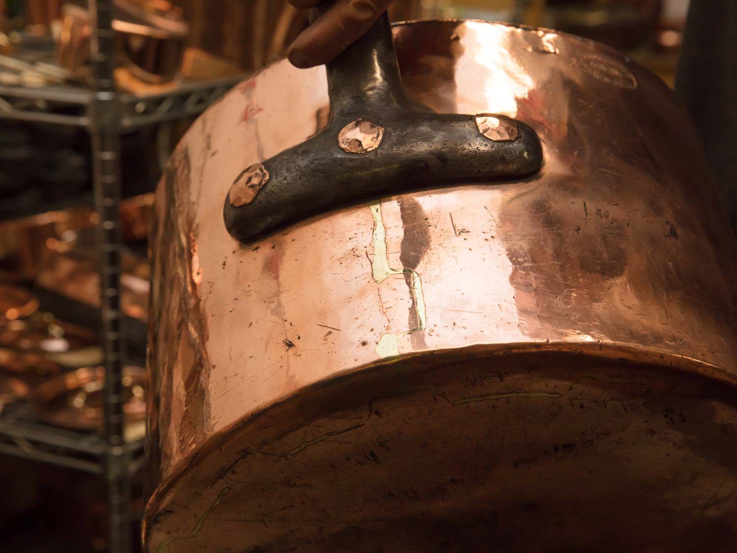 A copper pot spun by hand.