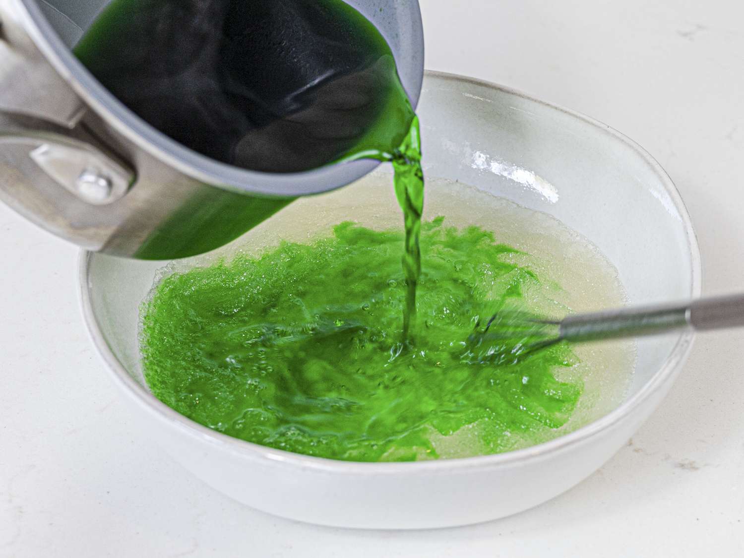 Gelatin being poured into coconut milk mixture
