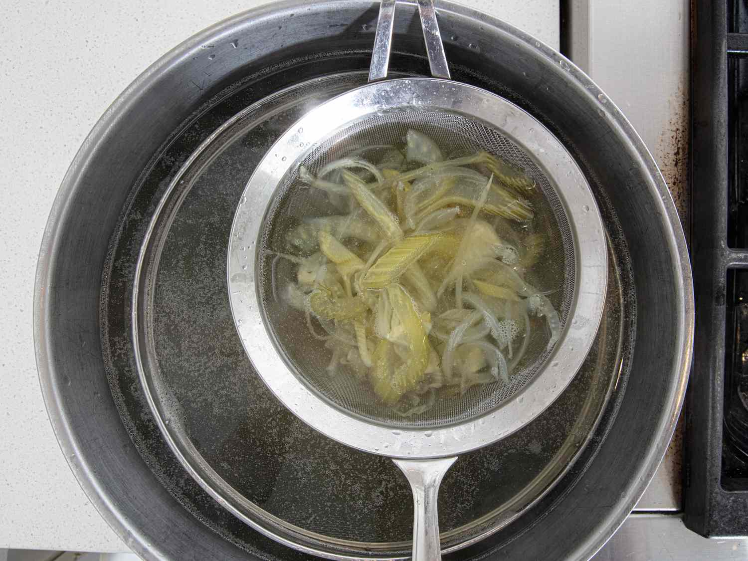 Overhead view of straining broth