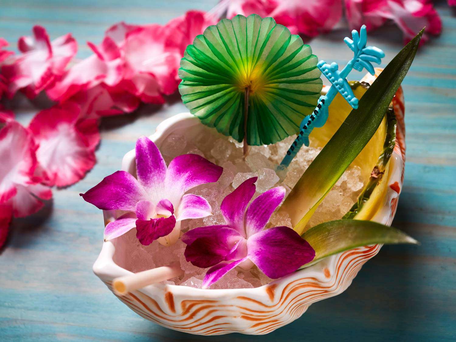 A fancy drink at Archipelago, garnished with flowers.