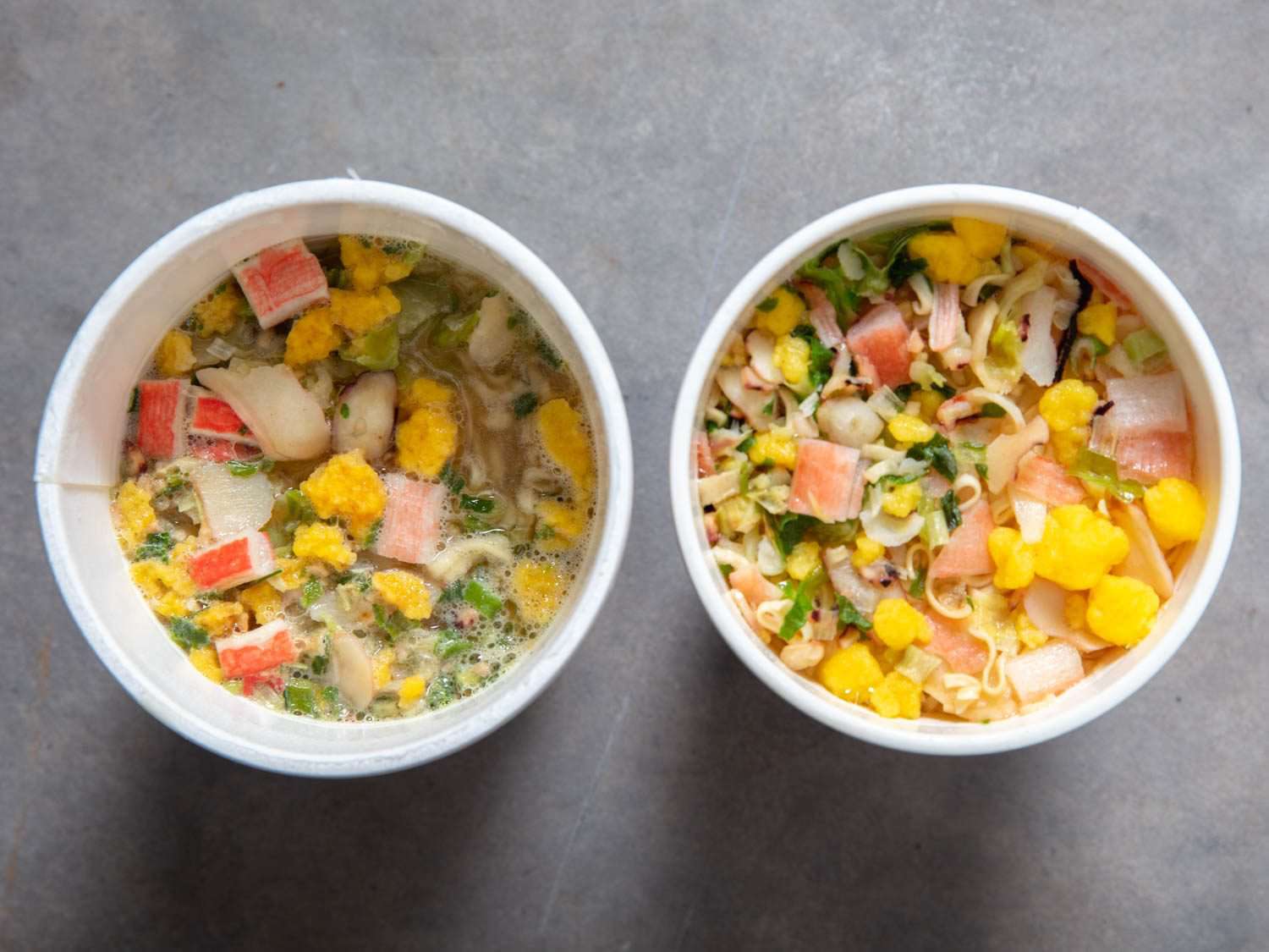 Overhead comparison shot of American Seafood Cup Noodle (left) and Japanese Seafood Cup Noodle (right)