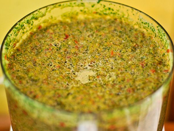 Puerto Rican sofrito in a food processor with all ingredients and spices added.