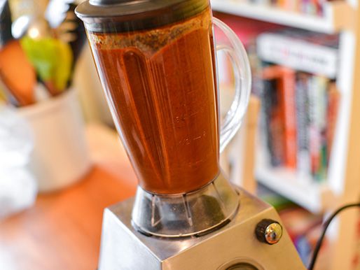 The braising liquid is puréed in a blender.