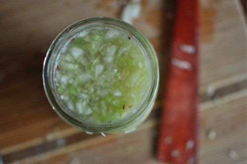 Overhead view of the shredded cabbage, submerged in its own purged juices.