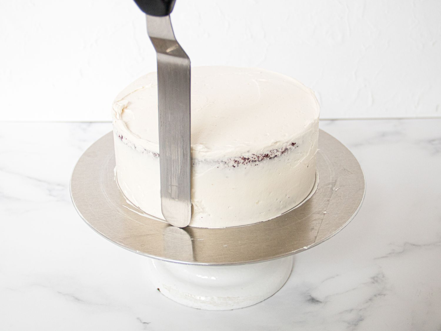 Side view of finishing the cake