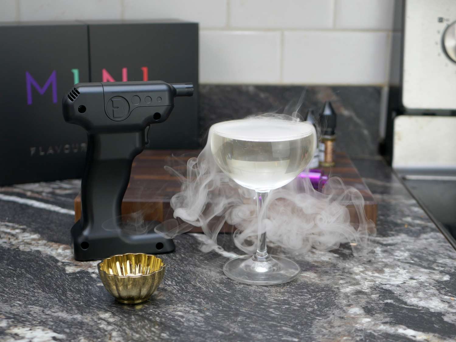 the flavour blaster mini with a popped bubble on a coupe glass