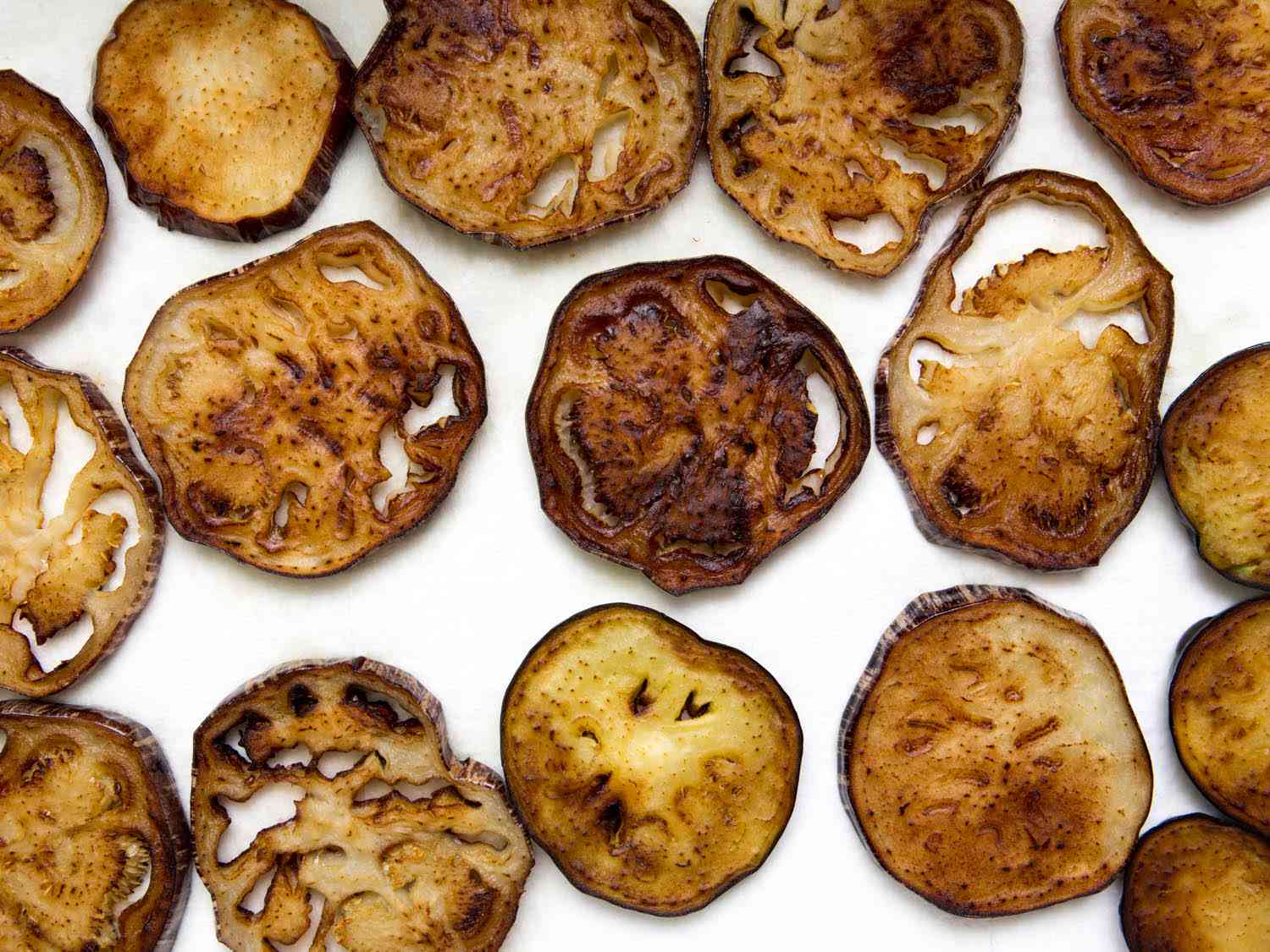Slices of fried eggplant ready for Italian-style eggplant parm.