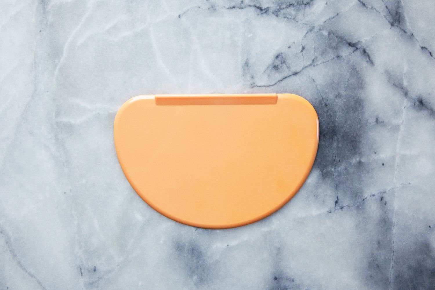 indigo bowl scraper on marble countertop