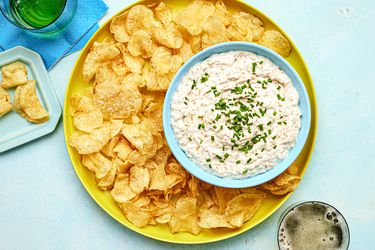 Overhead view of french onion dip surrounded by Chips