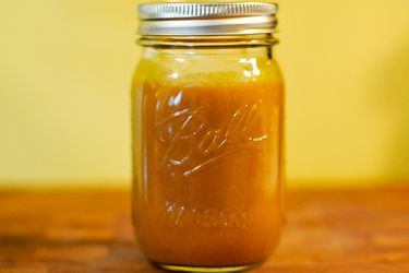 A jar of South Carolina-Style mustard sauce for barbecue.