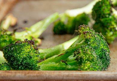Roasted broccoli florets on a sheet pan