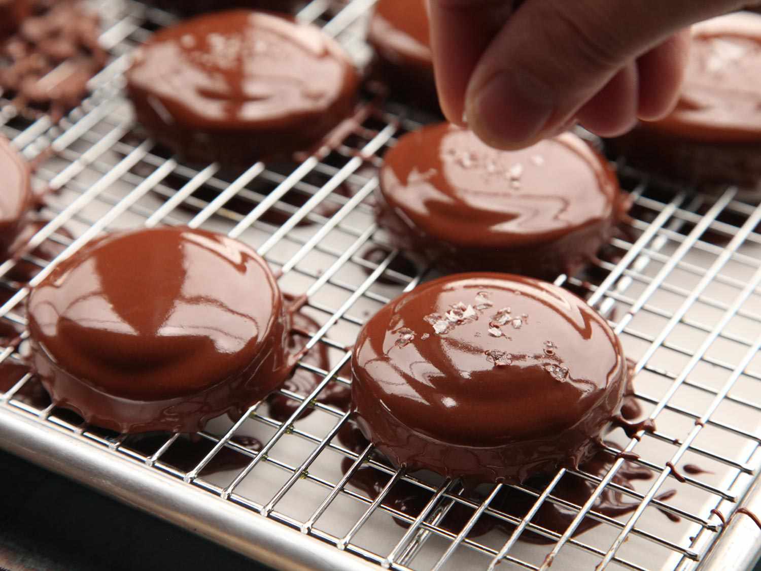 Sprinkling salt on homemade Twix. 