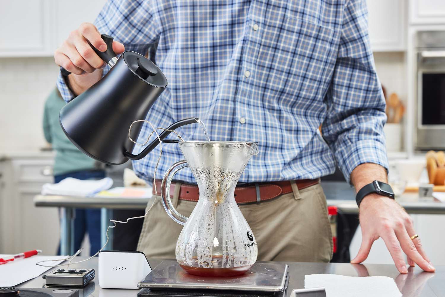 Person pouring water into the Coffee Gator Paperless Pour Over Coffee Maker